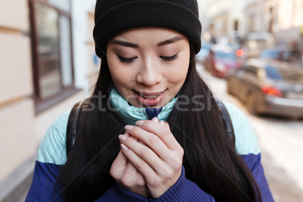 Gülen dondurulmuş Asya kadın sıcak elbise Stok fotoğraf © deandrobot
