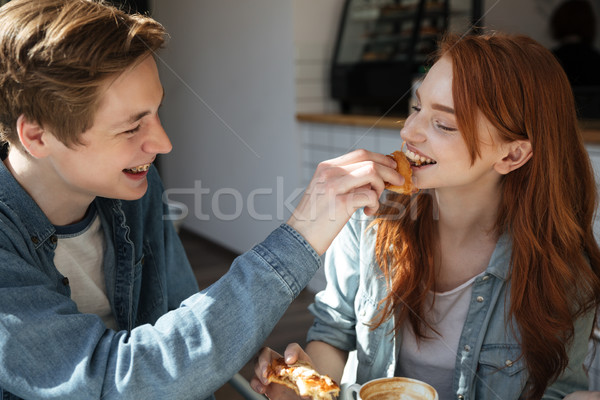 Stock photo: Careful boy feed his girl
