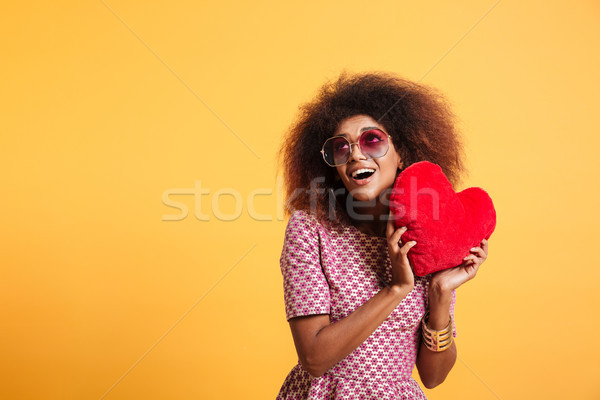 Portrait of an amused pretty afro american woman Stock photo © deandrobot