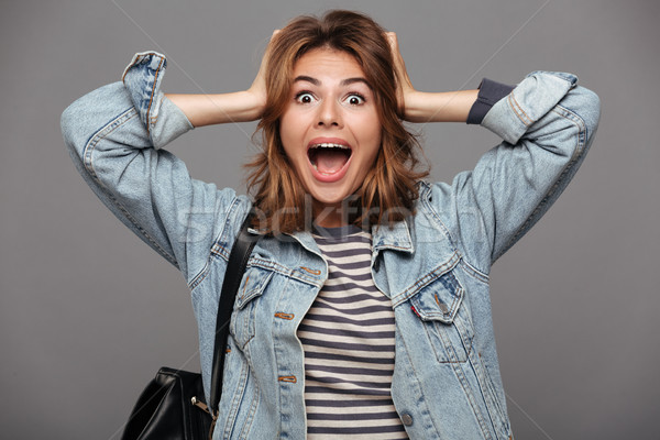 Portrait of a surprised astonished teenage girl Stock photo © deandrobot