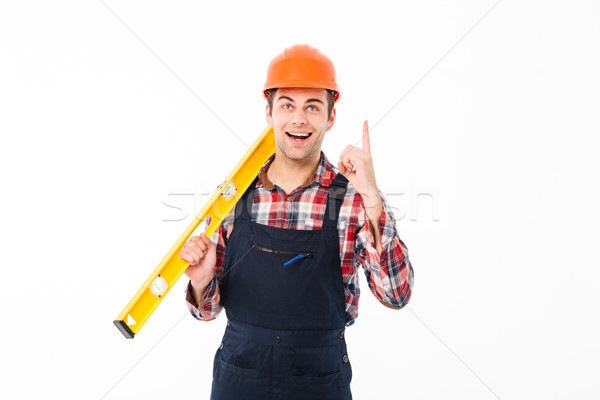Portrait of an excited young male builder Stock photo © deandrobot