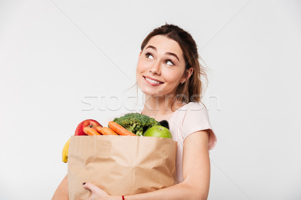 Close up portrait of a happy pretty girl holding bag Stock photo © deandrobot