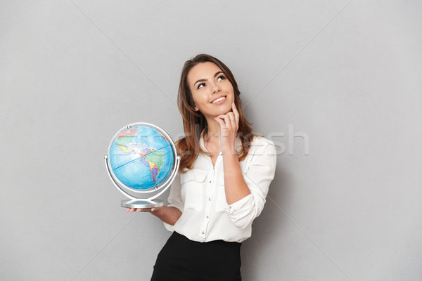 Portrait of a dreamy young business woman Stock photo © deandrobot