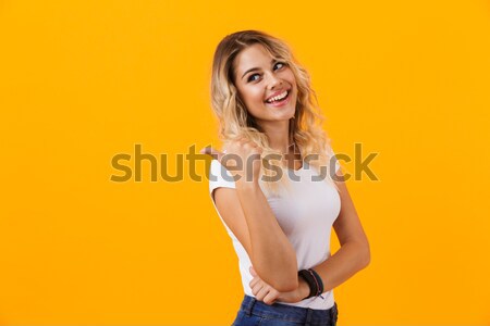 Photo of pretty young woman 20s with beautiful hairstyle wearing Stock photo © deandrobot