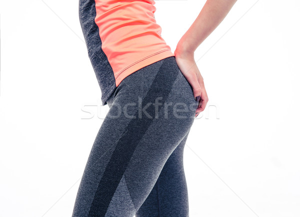 Closeup image of a slender female body in sports wear Stock photo © deandrobot