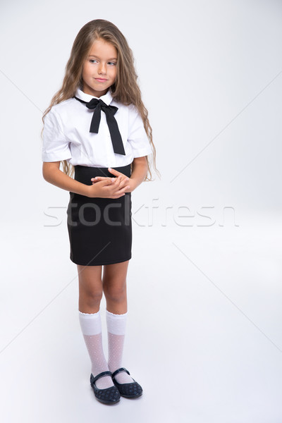 Teljes alakos portré kicsi iskolás lány áll izolált Stock fotó © deandrobot