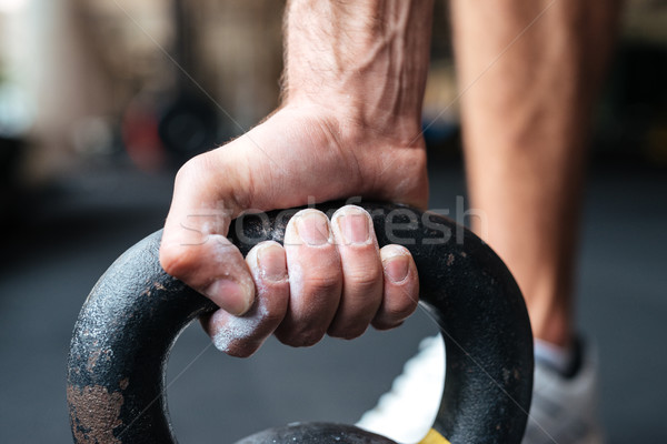 Immagine fitness mano kettlebell uomo Foto d'archivio © deandrobot