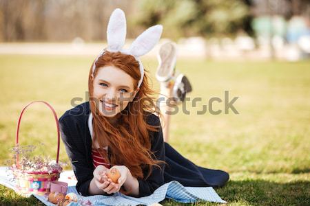 Portrait of a happy smiling girl with long ginger hair Stock photo © deandrobot