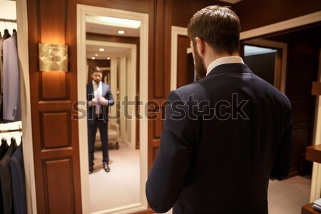 Close up shot of man back in suit Stock photo © deandrobot