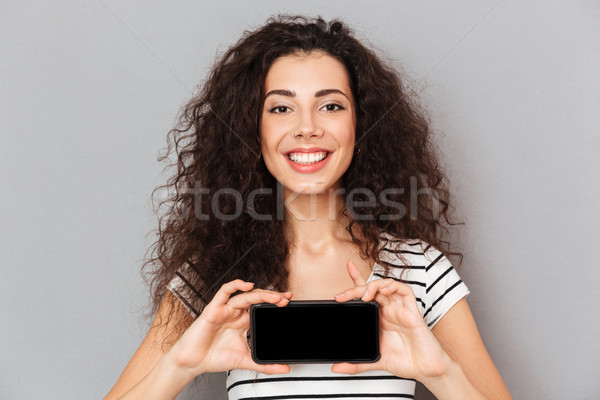 Optimistisch vrouw ring neus mobiele telefoon Stockfoto © deandrobot