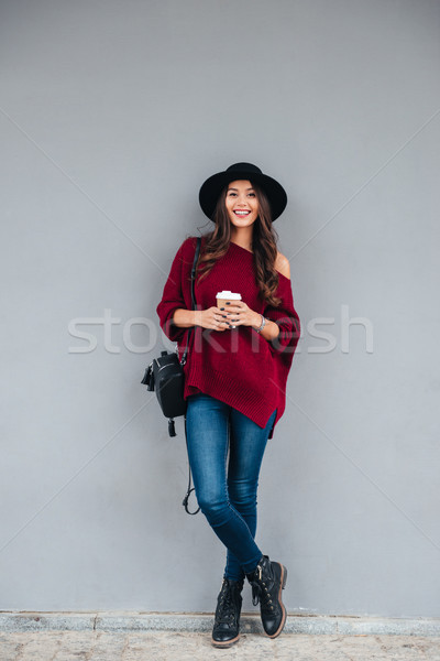 Stock photo: Full length portrait of a smiling pretty asian girl