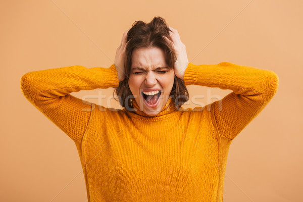 Screaming emotional young woman Stock photo © deandrobot