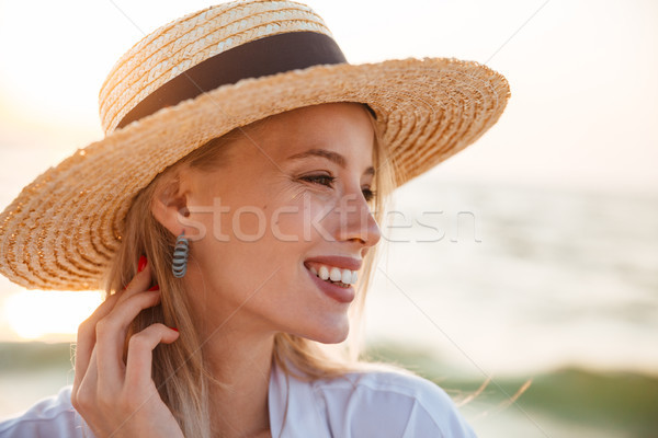 Close up of a smiling young girl in summer hat Stock photo © deandrobot