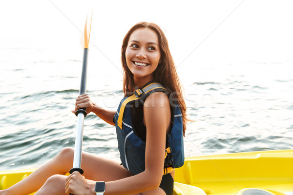 Mooie vrouw kajakken meer zee boot foto Stockfoto © deandrobot