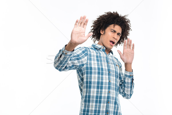 Young afro american man with disgust emotion Stock photo © deandrobot