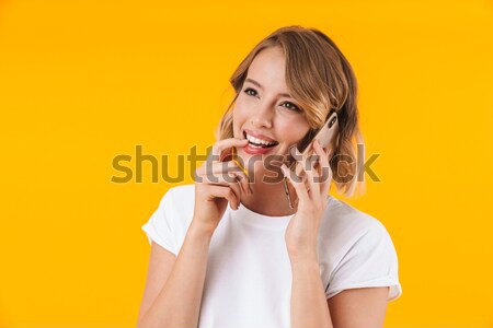 Portrait of cute playful young woman showing tongue Stock photo © deandrobot