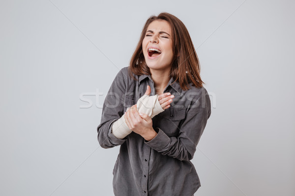 Gritando jovem senhora gesso mão imagem Foto stock © deandrobot