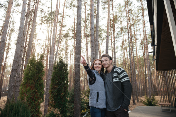 Couple standing on doorstep Stock photo © deandrobot