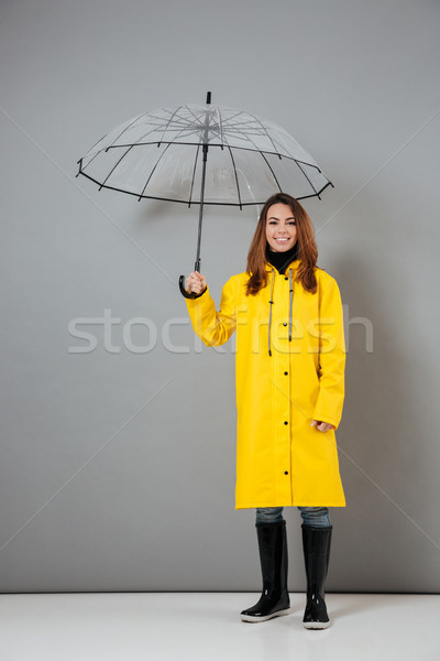 Porträt Mädchen glücklich Regenmantel Gummistiefel posiert Stock foto © deandrobot