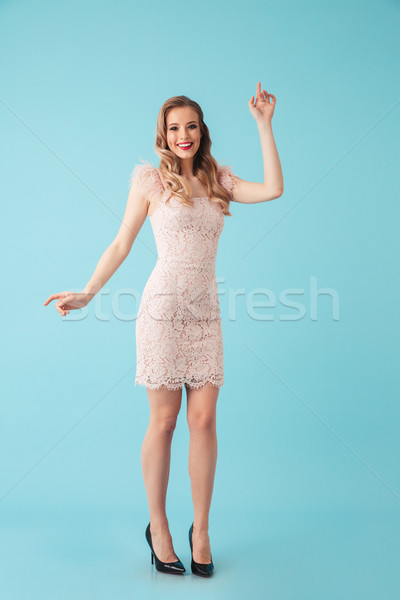 Full length image of elegant woman 20s wearing pink dress with m Stock photo © deandrobot