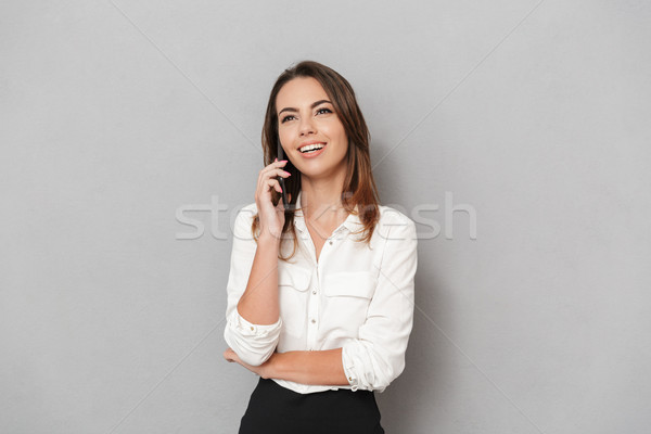 Portrait of a smiling young business woman Stock photo © deandrobot