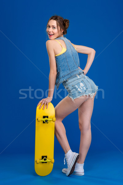 Feliz posando skateboard retrato Foto stock © deandrobot