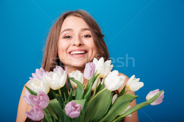 красивая женщина улыбаясь букет весенние цветы Сток-фото © deandrobot