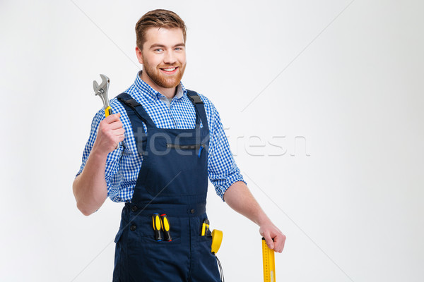 Portrait of a smiling male builder Stock photo © deandrobot