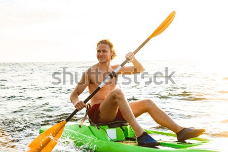 Stock photo: Beautiful young woman with eyes closed listening music