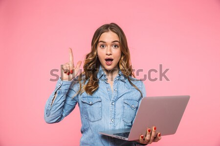 Young girl showing that she can not hear something clearly Stock photo © deandrobot