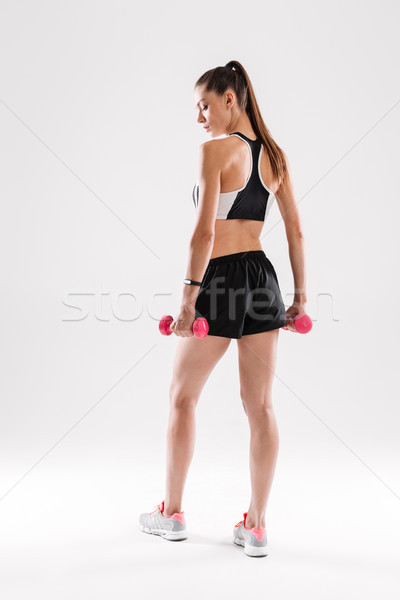 Blick zurück Porträt Sportlerin stehen halten Stock foto © deandrobot