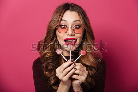 Portrait of a puzzled brown haired woman Stock photo © deandrobot