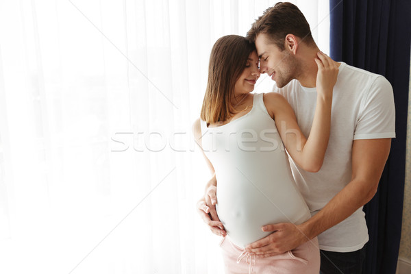 счастливым человека обнять беременна жена Сток-фото © deandrobot