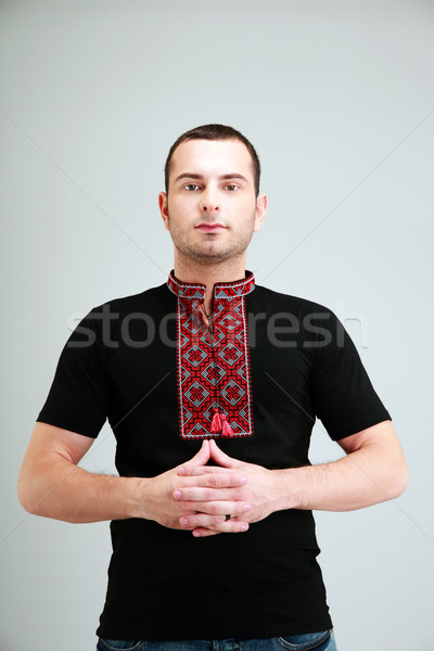 Portrait of man in the Ukrainian national clothes on gray background Stock photo © deandrobot