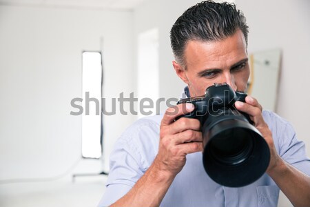 Photographer making photo on camera Stock photo © deandrobot