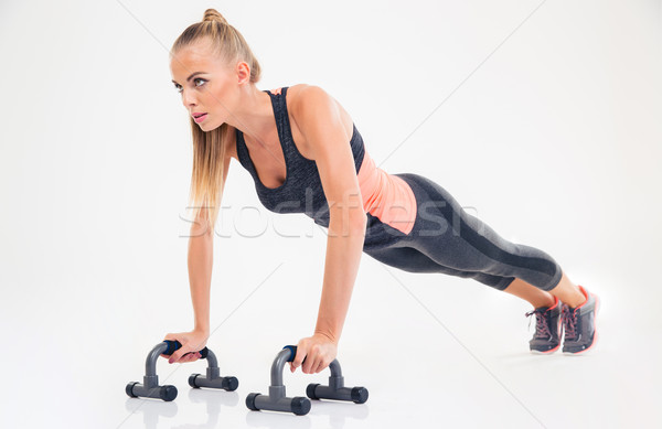 Portré fitnessz nő fekvőtámaszok izolált fehér modell Stock fotó © deandrobot