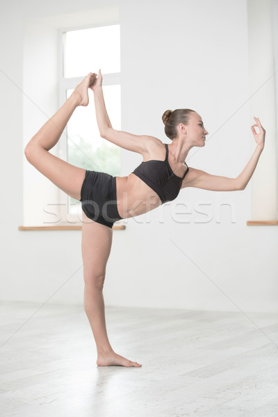 Beautiful woman doing stretching exercises Stock photo © deandrobot