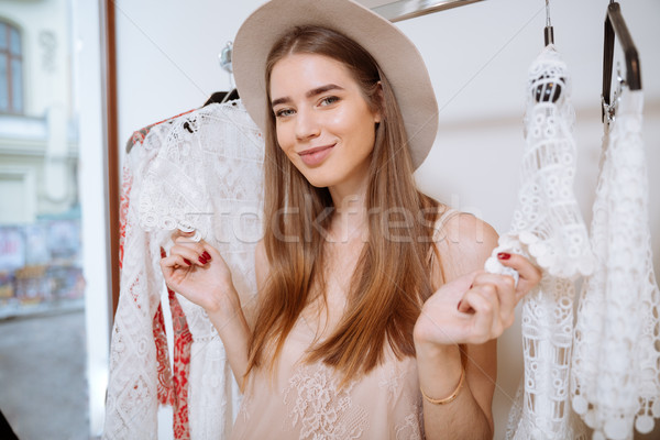 Derűs csinos fiatal nő vásárlás ruházat bolt Stock fotó © deandrobot