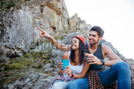 Happy couple make selfie on rock Stock photo © deandrobot