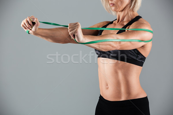 Cropped image of a muscular adult sportswoman Stock photo © deandrobot