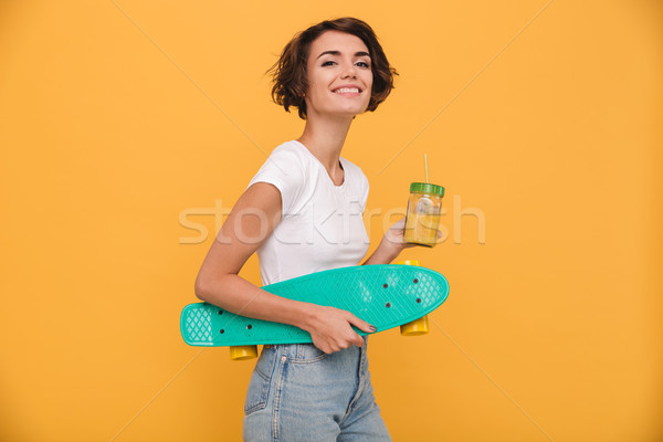 Portrait jeune fille skateboard potable Photo stock © deandrobot