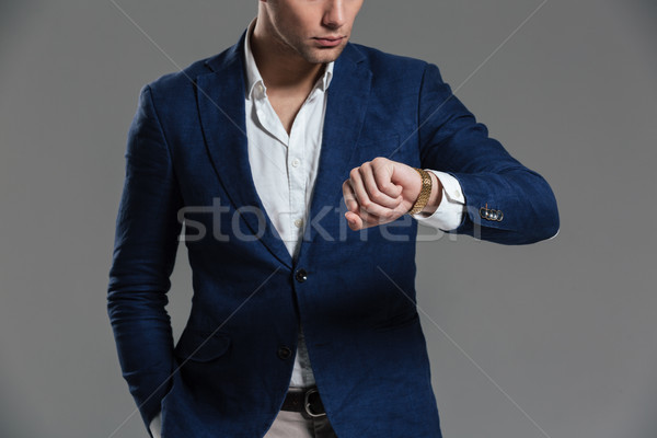 Cropped image of a concentrated young man Stock photo © deandrobot