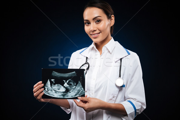 Jóvenes alegre médico ultrasonido escanear Foto stock © deandrobot