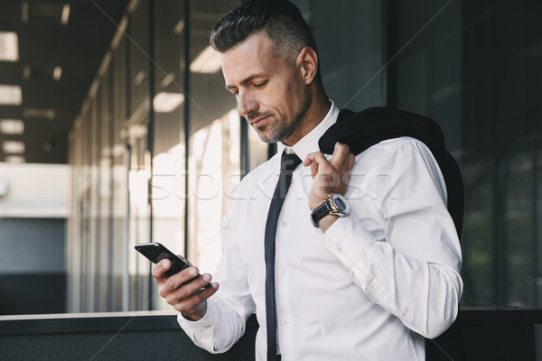 Stock photo: Portrait of a smiling young businessman