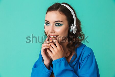 Portrait of a shocked young girl covering mouth Stock photo © deandrobot