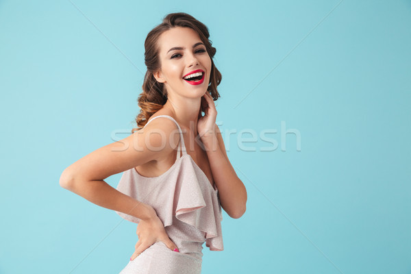 Image of happy brunette woman 20s wearing party outfit smiling a Stock photo © deandrobot
