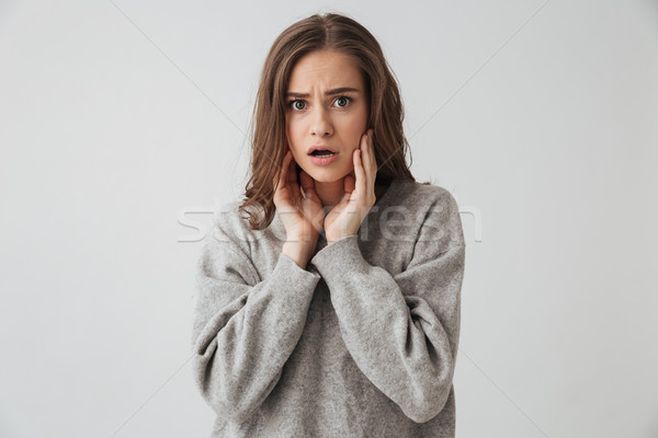 Brunetka kobieta sweter dotknąć policzki Zdjęcia stock © deandrobot