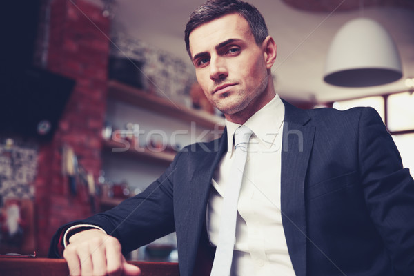 Confident businessman in formal cloths resting in the kitchen Stock photo © deandrobot