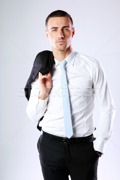 Gut aussehend Geschäftsmann halten Jacke Schulter grau Stock foto © deandrobot