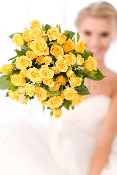 Closeup portrait of a bride holding flowers Stock photo © deandrobot